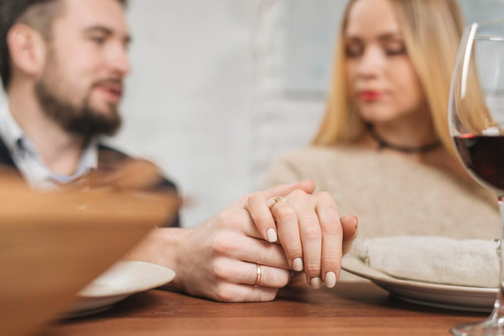 Couple holding hands, symbolizing emotional support and the importance of relationships in mental well-being for men.